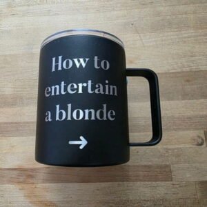 How to Entertain a Blonde Black Engraved Camper Mug